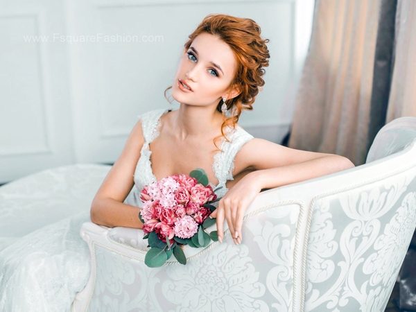 picture of Cute Girl in wedding dress holding flowers images