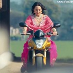 Sonakshi Sinha Cute Pictures on Moterbike In Son of Sardar Movie 2012