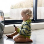 Baby Watching TV on World Television Day Wallpapers